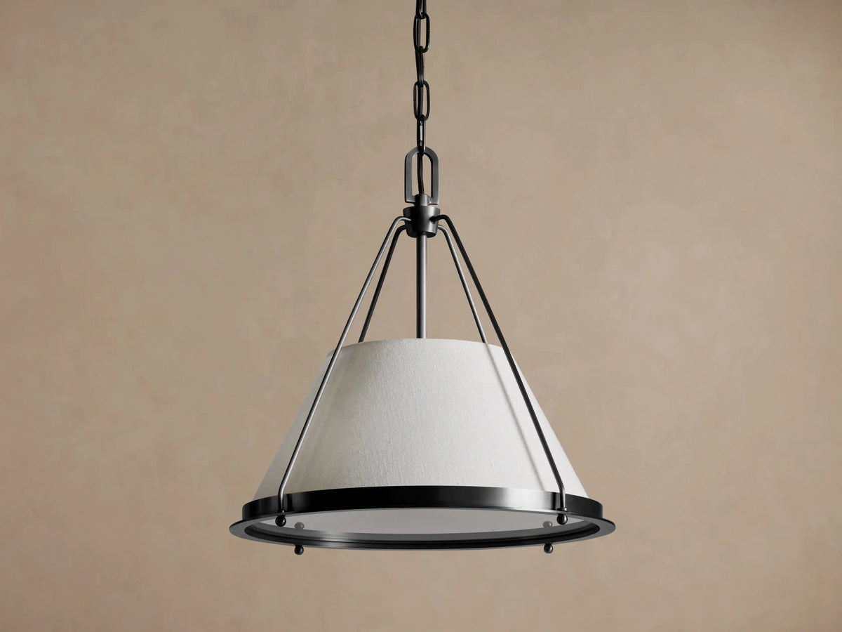Shelton Pendant: conical light linen shade with dark bronze metal frame, suspended from a matching chain against a neutral background.