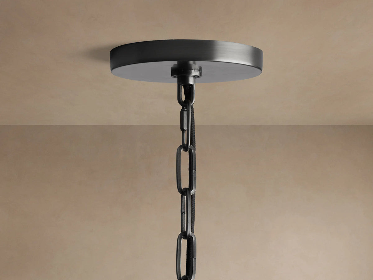 Close-up of Shelton Pendant with white tapered linen shade, dark bronze-plated metal frame, and white diffuser viewed from below.