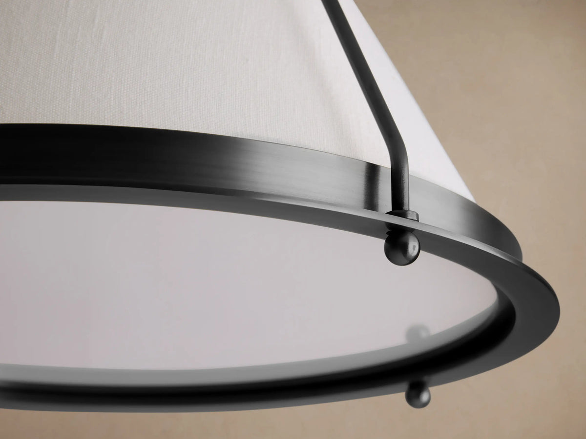 Shelton Flush Mount: Tapered off-white linen shade and dark metal frame, angled view against a neutral beige ceiling.