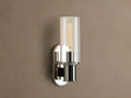 Harlin Sconce with polished nickel finish and clear glass cloche, mounted vertically on a wall, showing an Edison bulb.