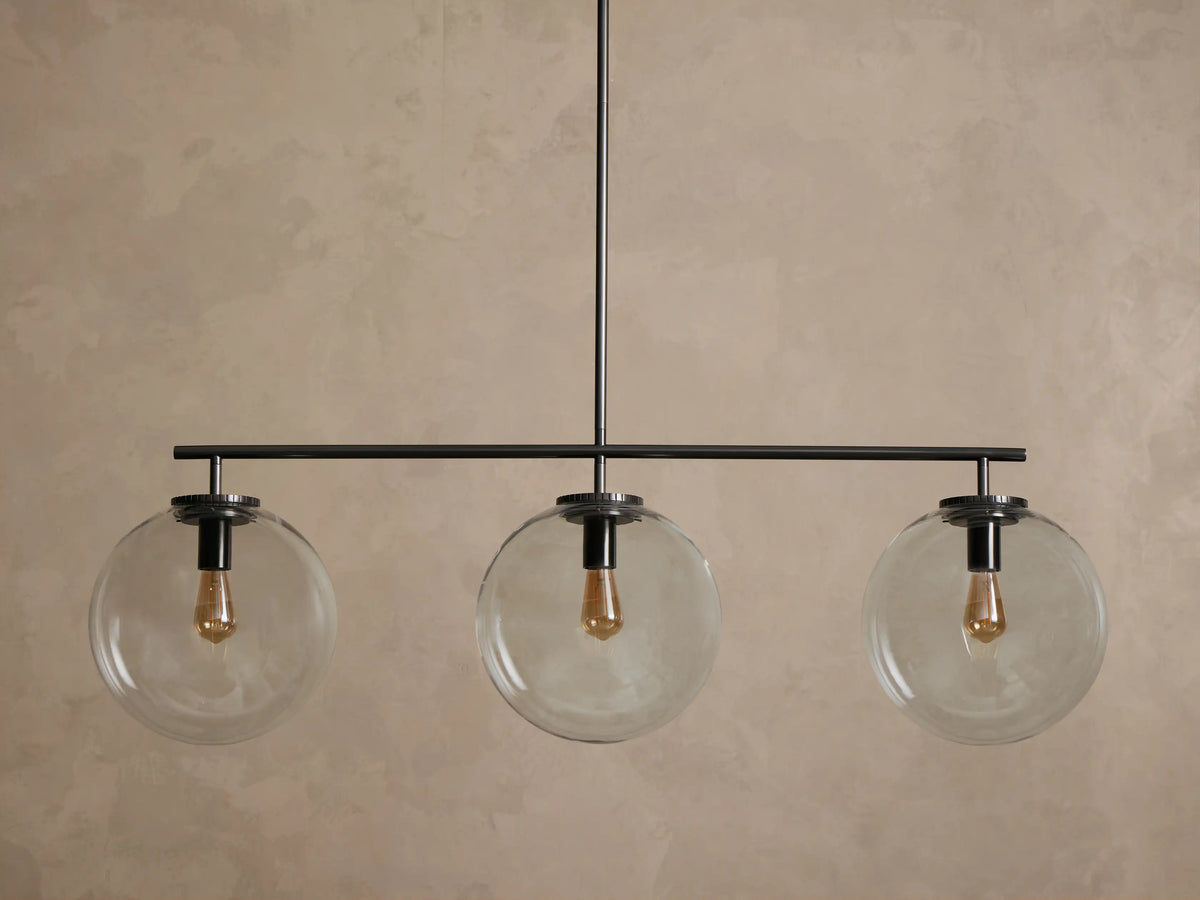 Upward view of a dark metallic light fixture ceiling mount, with a circular canopy, ridged edge, and connecting rod.