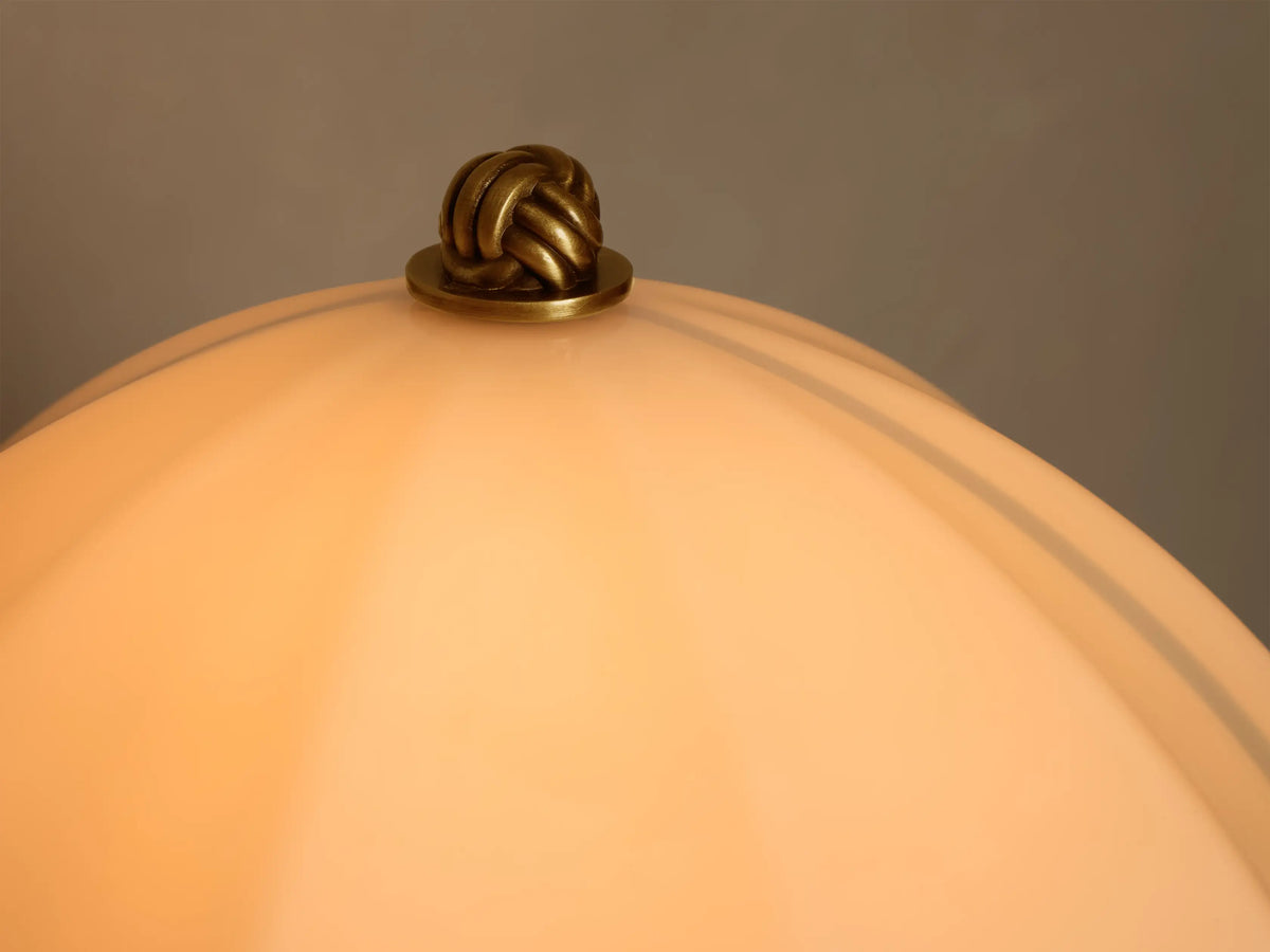 Front view of Cream Fluted Shade Brass Table Lamp, featuring a dome-shaped fluted shade, thin stem, and round base.