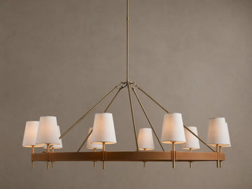 Hastings Round Chandelier, antiqued brass frame with brown leather, and 8 glowing white linen shades.