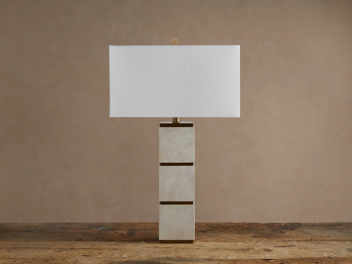 Micha Tall Table Lamp with an illuminated white linen rectangular shade & tall parchment leather and brass base.