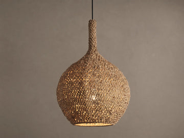 Canela 15" Pendant: Bell-shaped, natural tan handwoven banana rope fixture, glowing warmly, suspended.