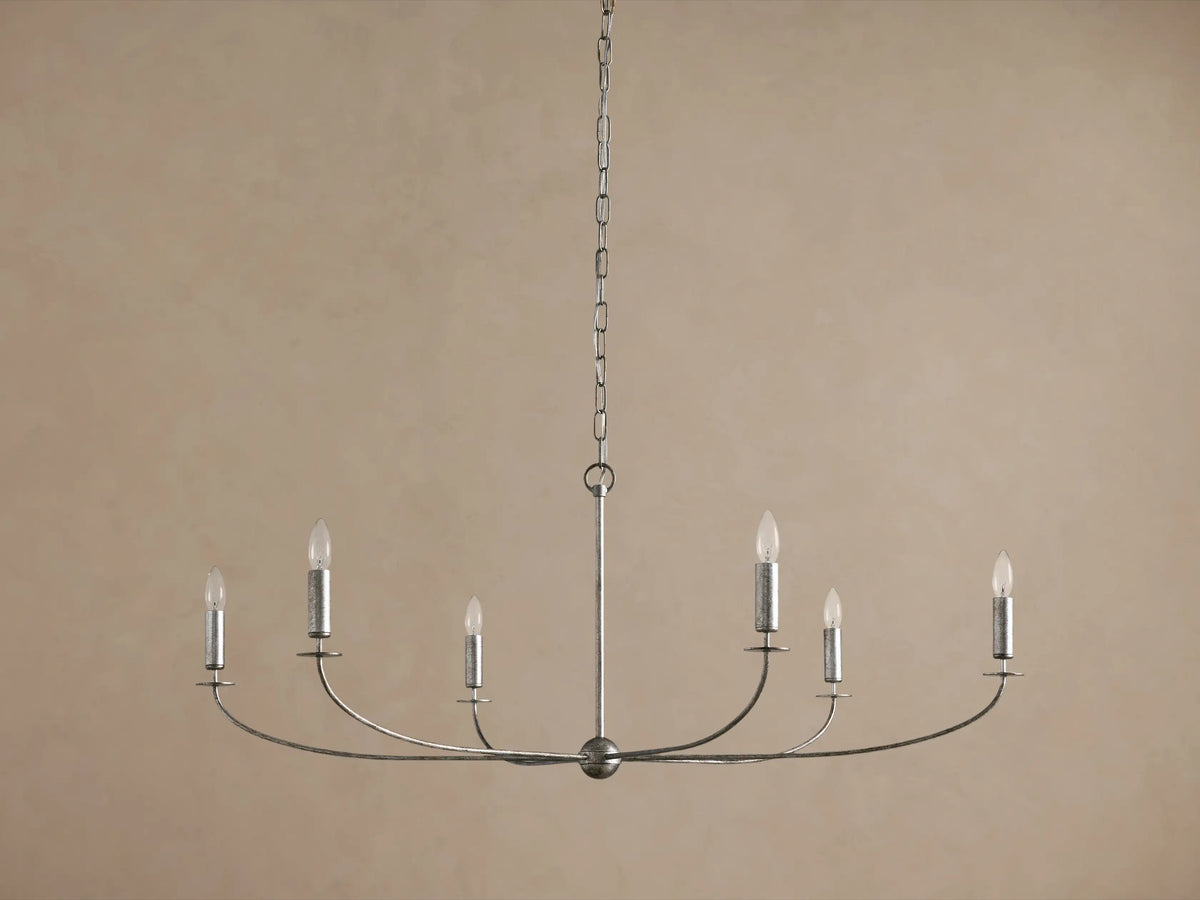 Arnett Round Chandelier. Antiqued silver finish iron frame, 6 candelabra bulbs on curved arms, hanging from chain.