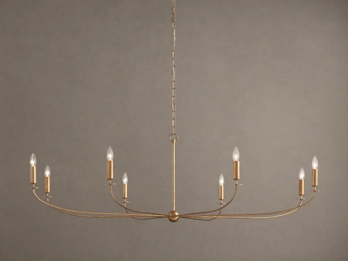 An Arnett Chandelier, an 8-light golden iron fixture with an antiqued leaf finish. Curved, elongated shape, suspended by chain.