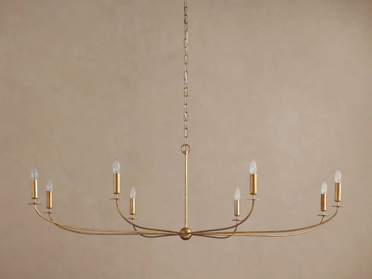 Arnett 8-light chandelier with an antiqued leaf finish, featuring clear candle-style bulbs on a horizontal frame, suspended by a chain.