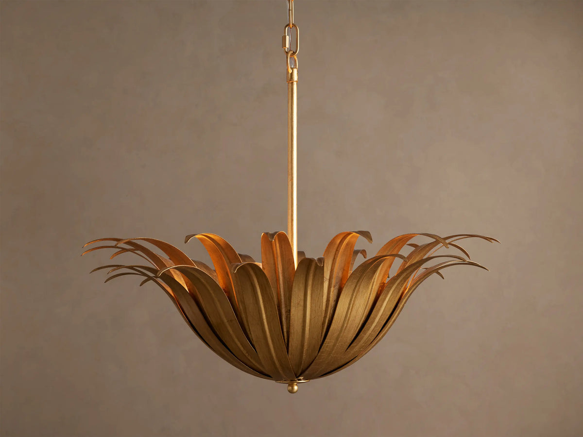 Matilde Pendant: antique-gold iron fixture with curved, overlapping petals forming a flower-like bowl, hanging from a chain.