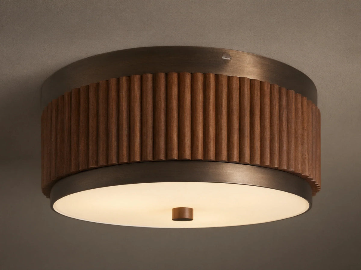 A circular ceiling lamp with a wooden, ribbed outer finish and a smooth, white frosted diffuser, emitting a warm light.