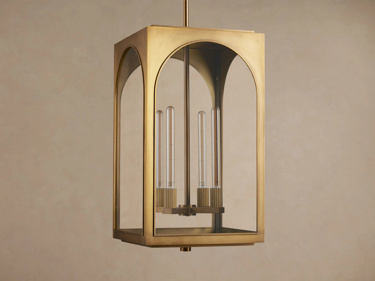 Golden brass Palladian Outdoor Pendant with arched clear glass and three clear tubular bulbs, hanging.