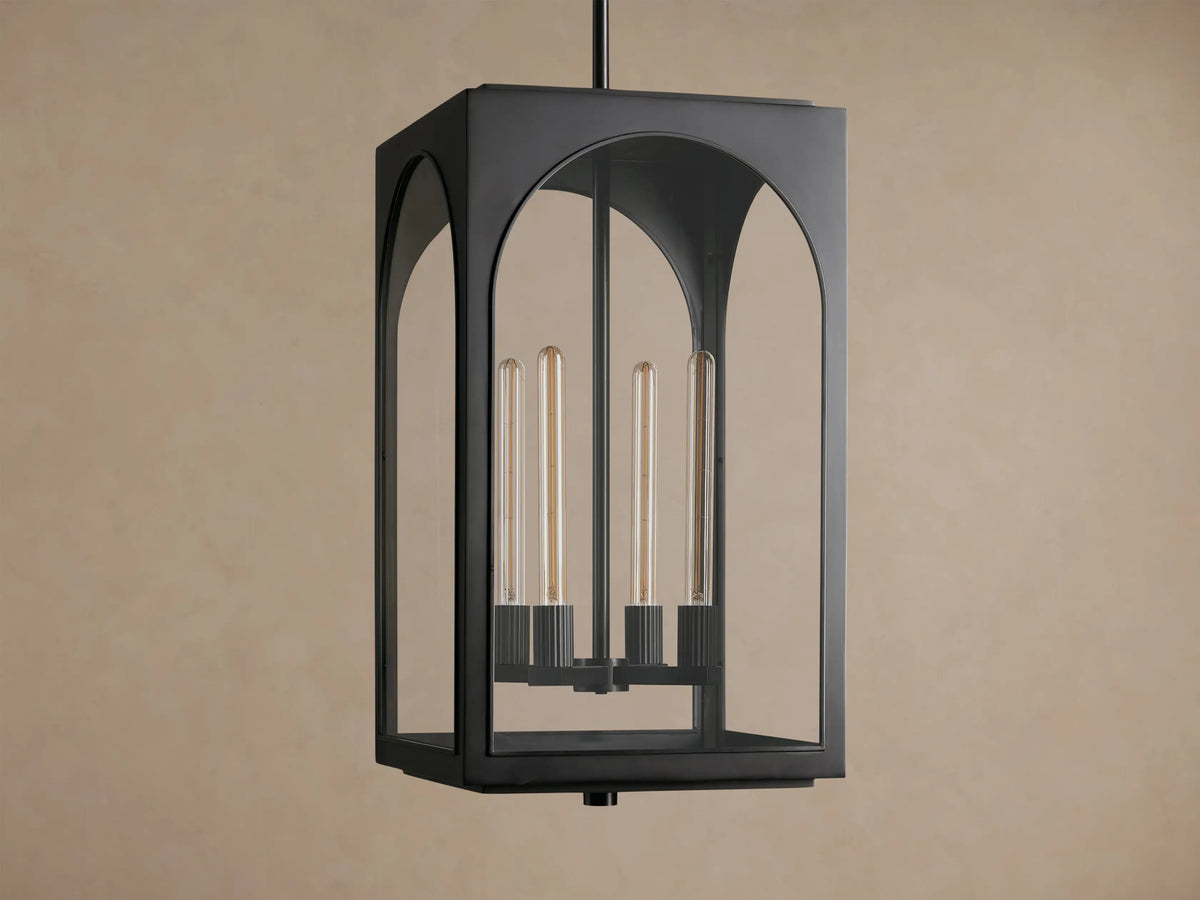Black Palladian Outdoor Pendant, rectangular lantern with arched clear glass panels, displaying four tubular bulbs, hanging from above.