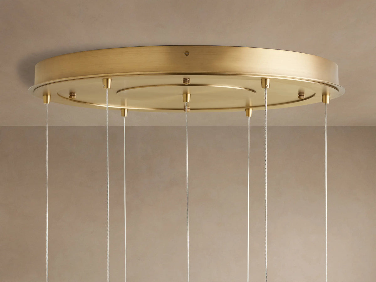 Casen Round Chandelier: round satin brass ceiling mount with multiple thin silver wires suspended, viewed from below.