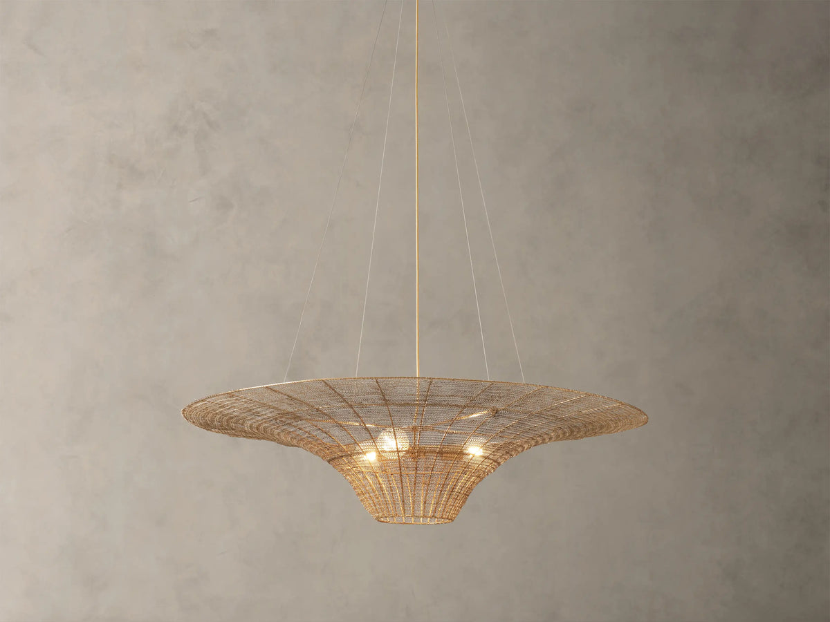 Mirza Caping Chandelier in antique brass finish, woven stainless steel and brass, disc shape with three visible bulbs, suspended by cables.