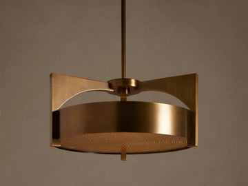 Burnished brass Alastair Pendant. Cylindrical shade, angular side supports, and a textured acrylic diffuser, hanging from above.