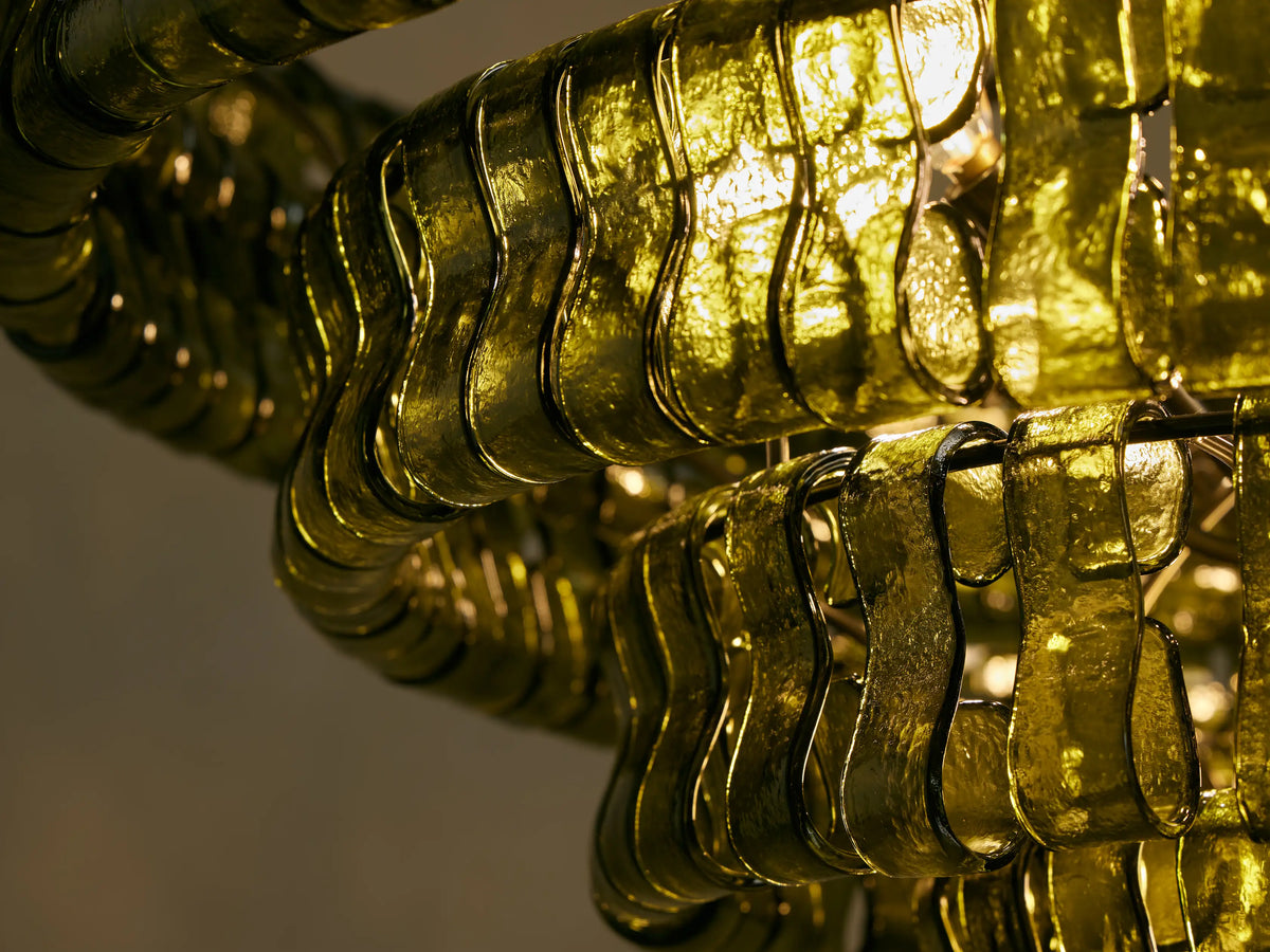 Ghiaccio Round Chandelier: Dark green tiered design with rectangular curved glass pieces, suspended from chain.