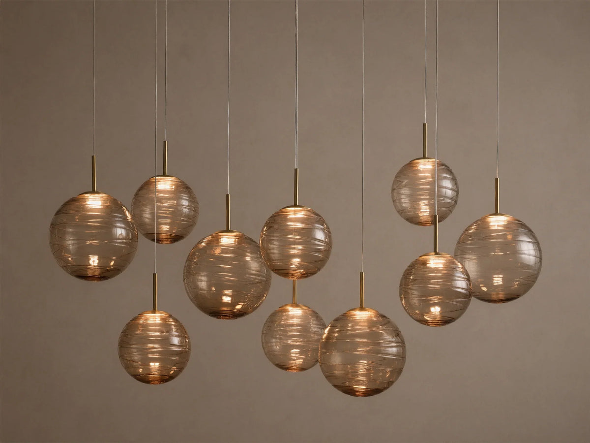 Casen 65" Linear Chandelier in Brass with Brown Sugar Globes (4 of 4)