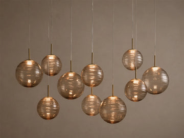 Casen 65" Linear Chandelier in Brass with Brown Sugar Globes (4 of 4)