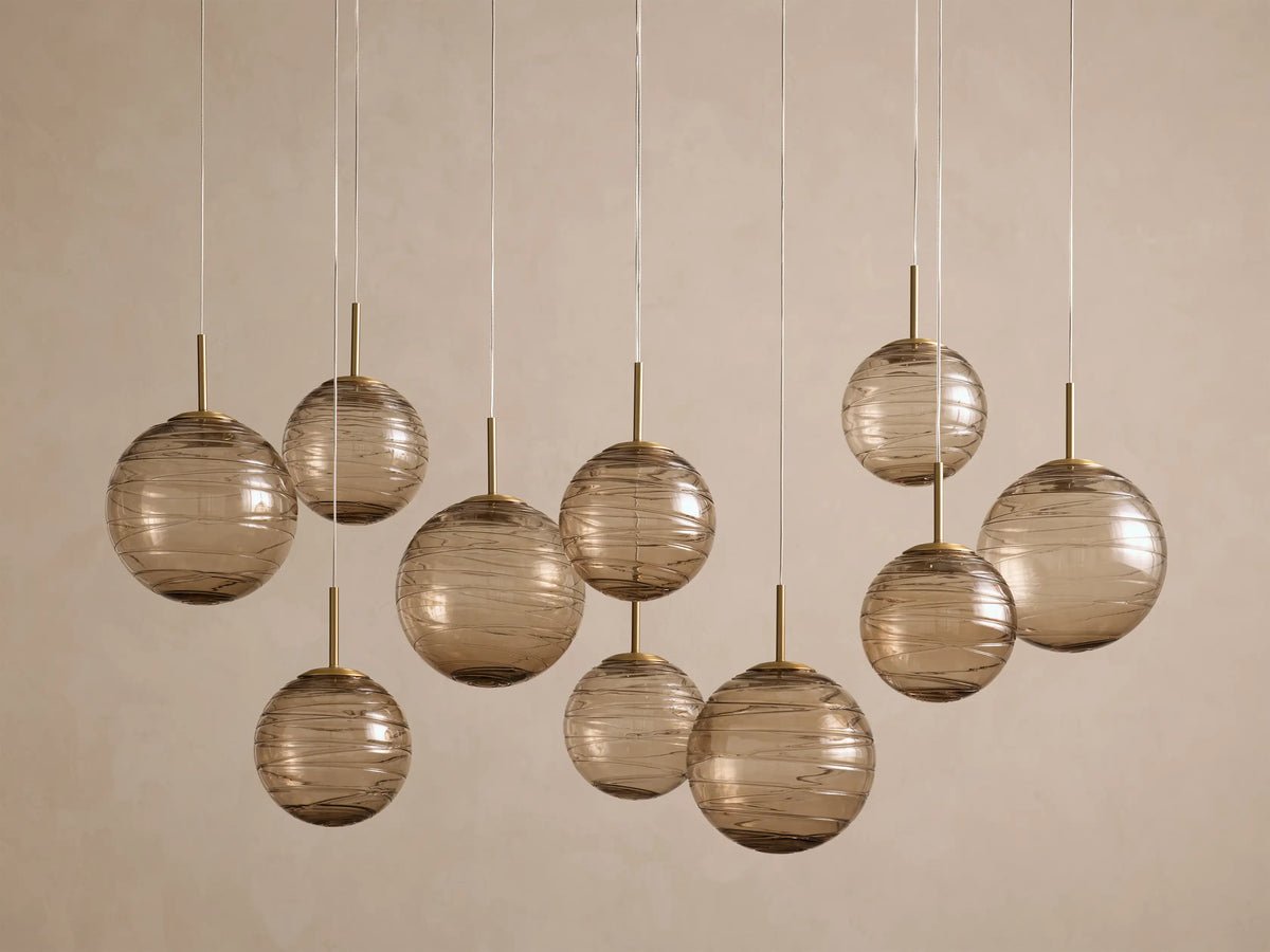Casen 65" Linear Chandelier in Brass with Brown Sugar Globes (4 of 4)