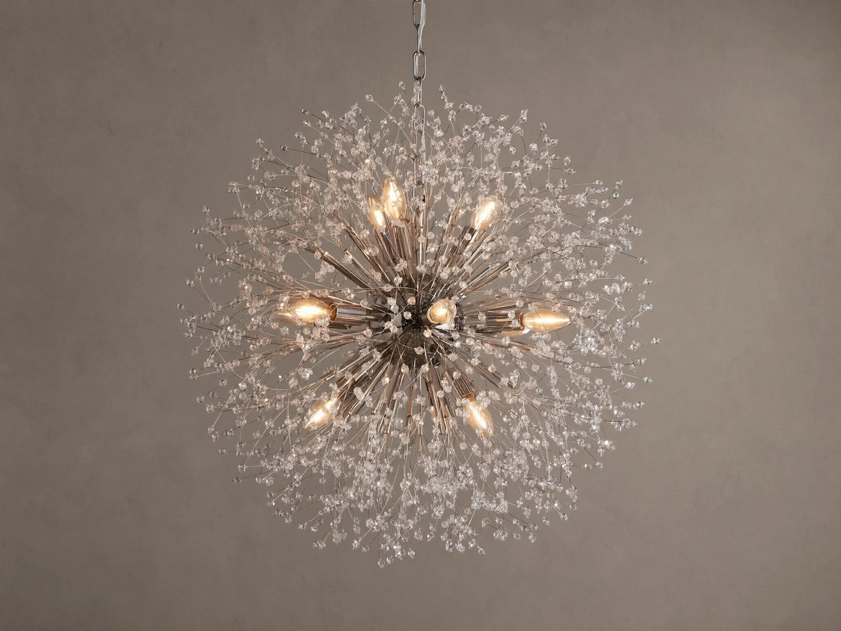 Dandelion Round Chandelier, nickel-plated with many thin arms radiating out, adorned with clear glass crystals and warm lit bulbs.