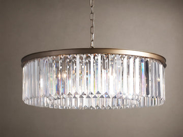 Leyland Round Chandelier with sparkling K9 crystals refracting light, dark bronze frame, suspended by a chain.