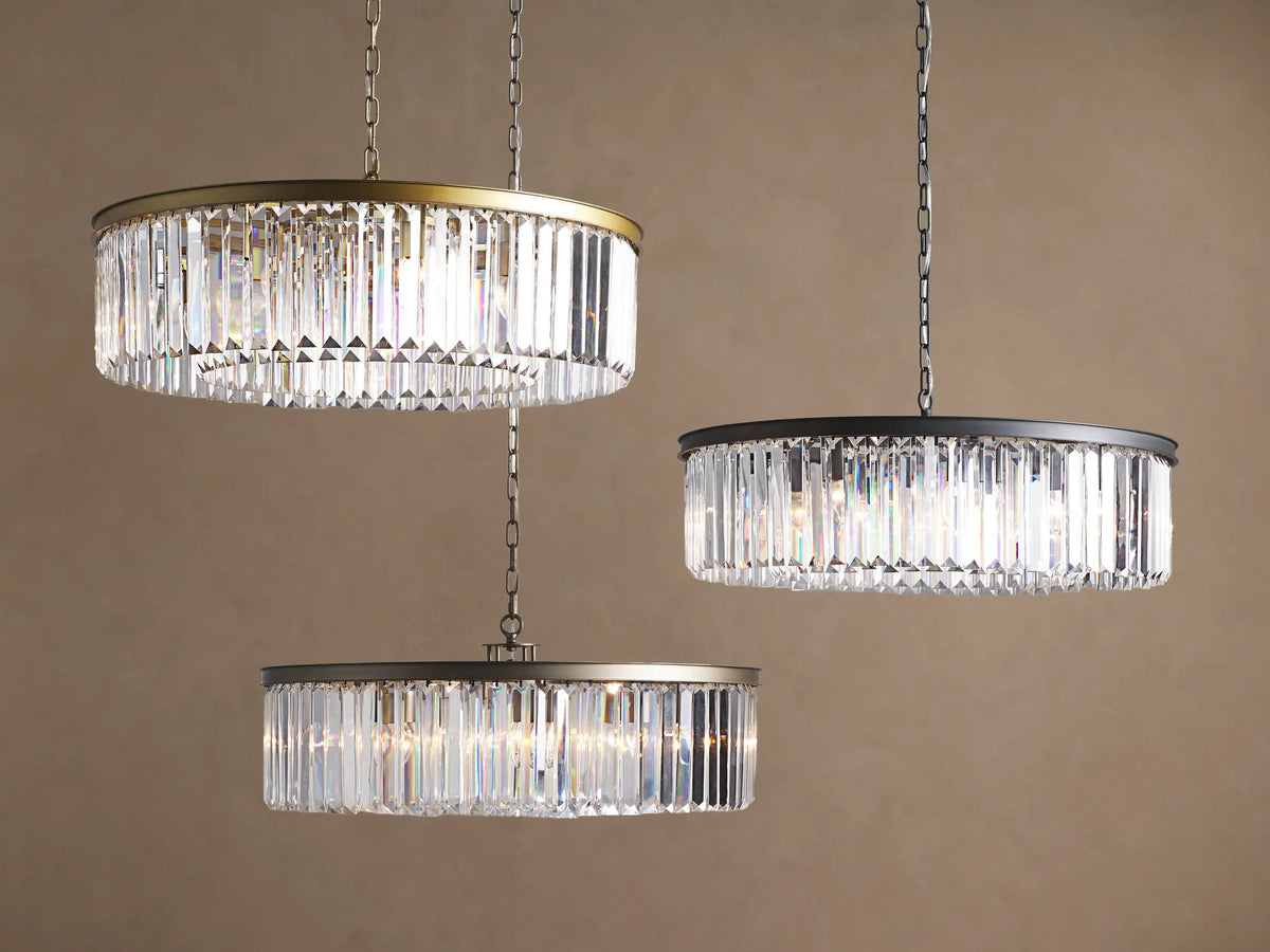 Close-up of Leyland Round Chandelier's dark oil-rubbed bronze canopy mounted to a light ceiling with a hanging iron chain.