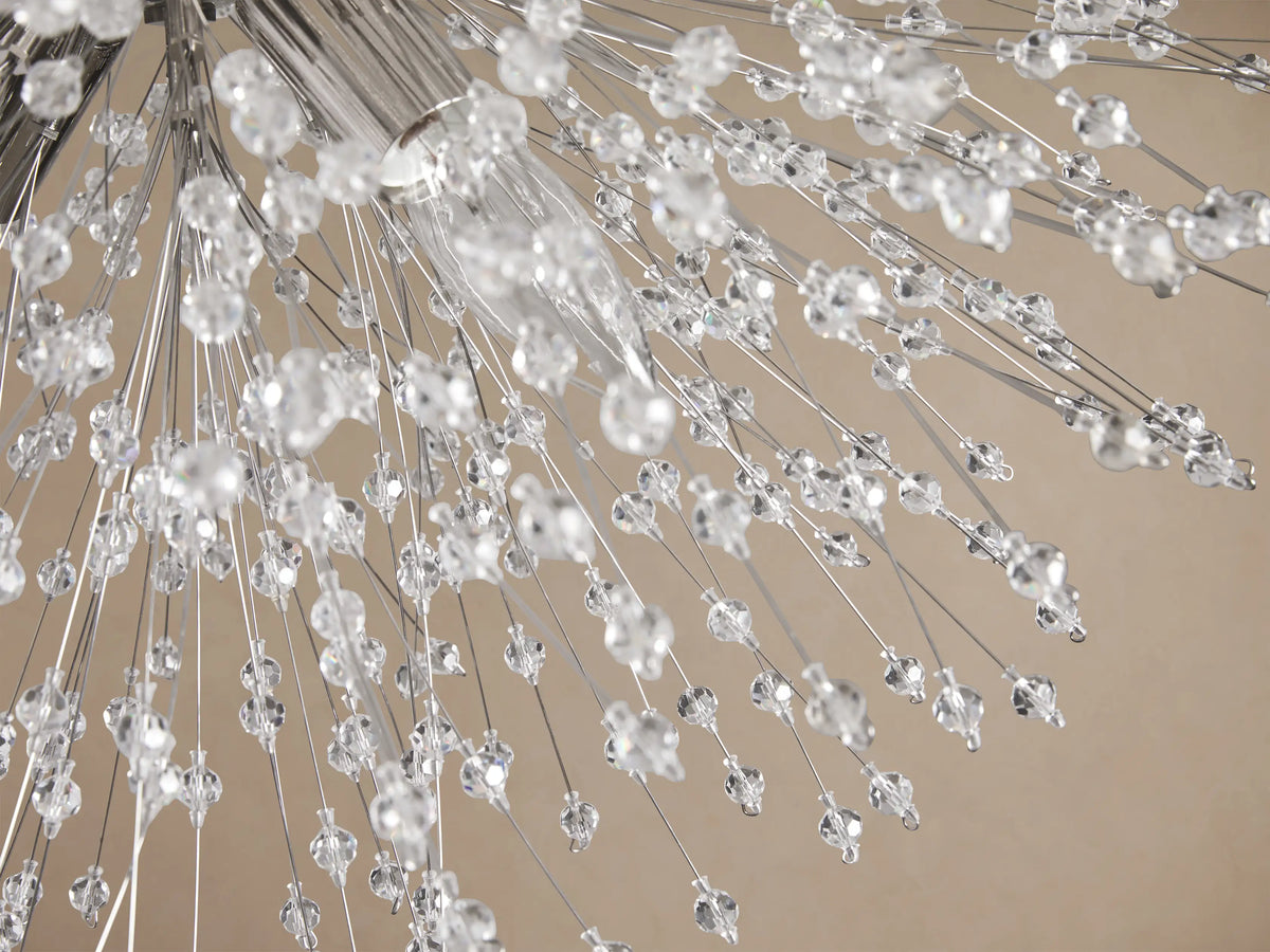 Sparkling Dandelion Flush Mount with clear crystal beads radiating from a polished chrome base against a light brown ceiling.