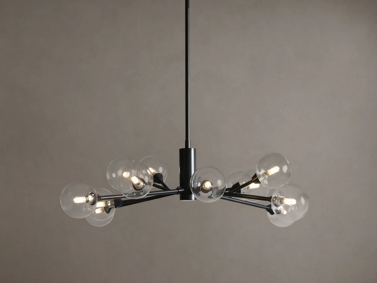Apollo Round Chandelier: Black iron arms holding clear glass globes with illuminated bulbs, suspended on a tan background.