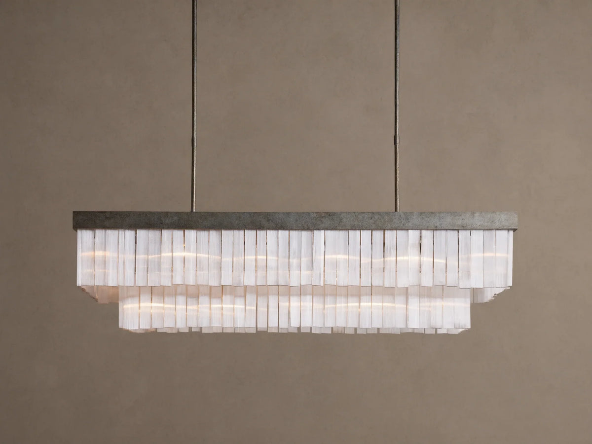 Cameron Rectangular Chandelier with antique silver frame, layers of glowing white selenite pieces, suspended from above.