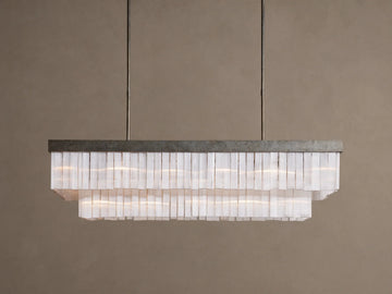 Cameron Rectangular Chandelier with antique silver frame, layers of glowing white selenite pieces, suspended from above.