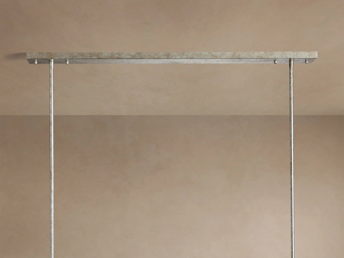 Cameron Rectangular Chandelier: Close-up of antique silver frame & multiple layers of translucent white selenite with warm light.