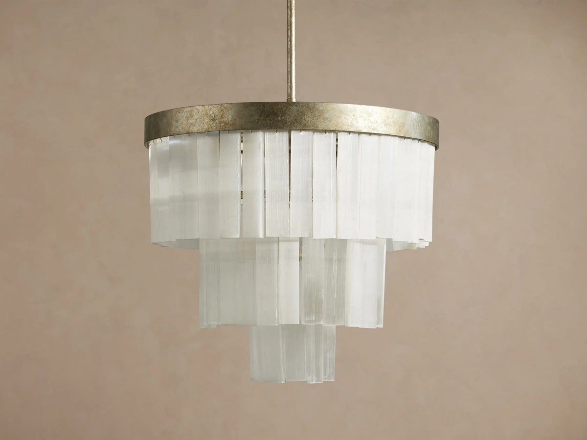Cameron Round Chandelier: an antique silver ring tops tiered, translucent white selenite panels, emitting a warm glow.