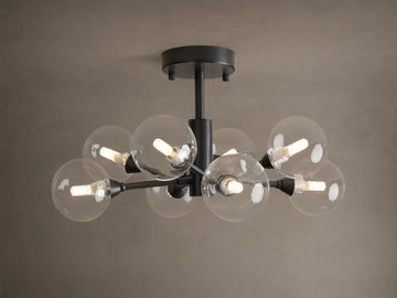 Apollo Flush Mount, dark metal, with eight clear spherical bulbs glowing. Mounted on a light brown ceiling.