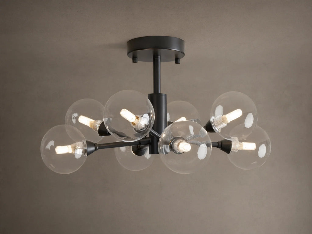 Apollo Flush Mount, dark metal, with eight clear spherical bulbs glowing. Mounted on a light brown ceiling.