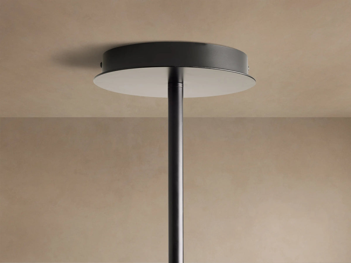 Close-up of the Roscoe Chandelier's dark bronze ceiling mount with a silver-toned disc and a dark connecting rod.