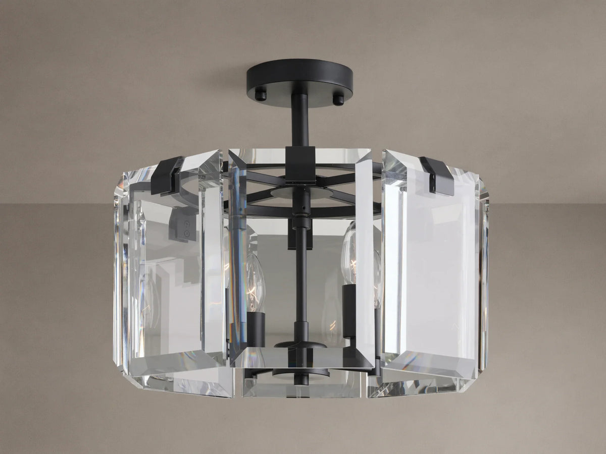 Amaya Flush Mount: black metal fixture with geometric clear, faceted crystal panels, mounted on a ceiling, bulbs off.