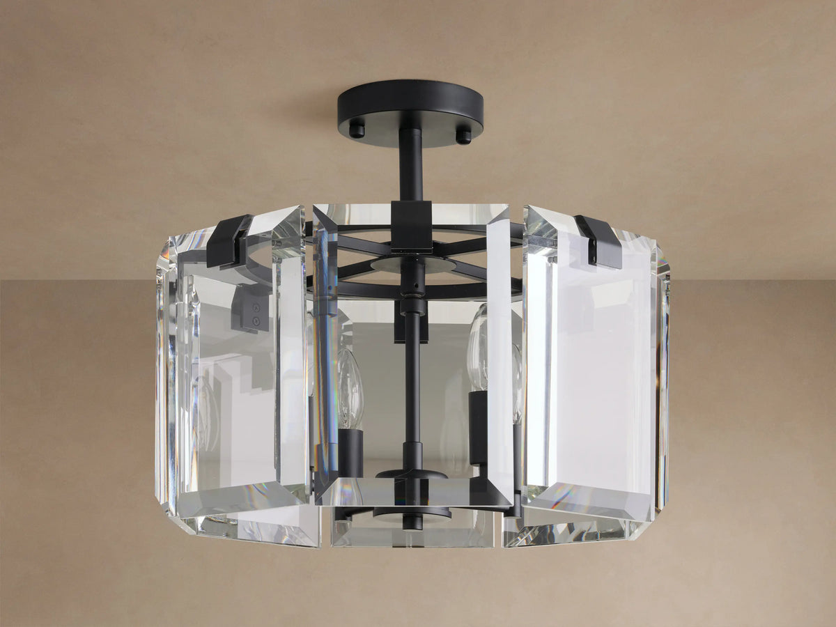 Amaya Flush Mount: black metal fixture with geometric clear, faceted crystal panels, mounted on a ceiling, bulbs off.