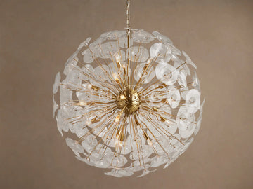 A large, round Lily Chandelier made of golden rods and many clear glass petals, with lights glowing inside.