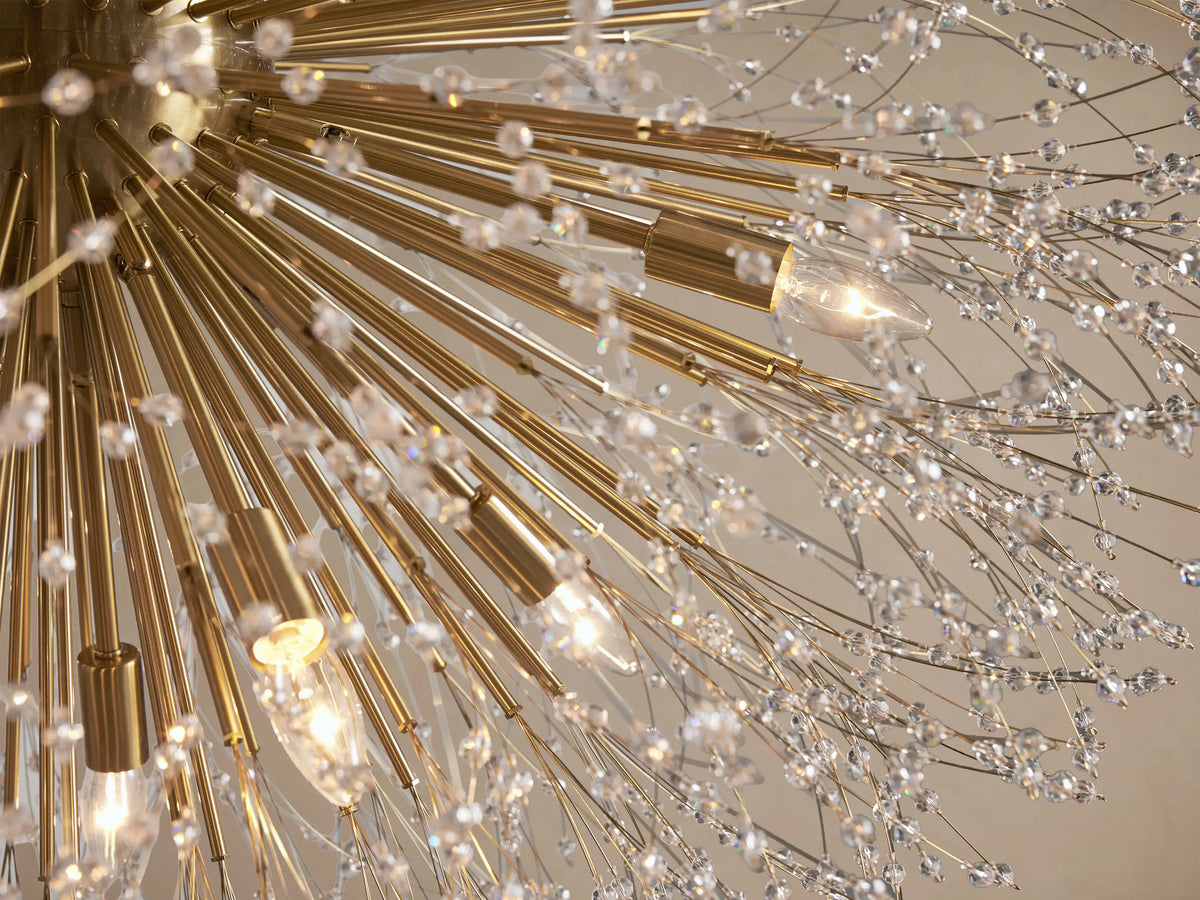 Gold Dandelion Round Chandelier, spherical with radiating arms, adorned with sparkling clear glass crystals, hanging.
