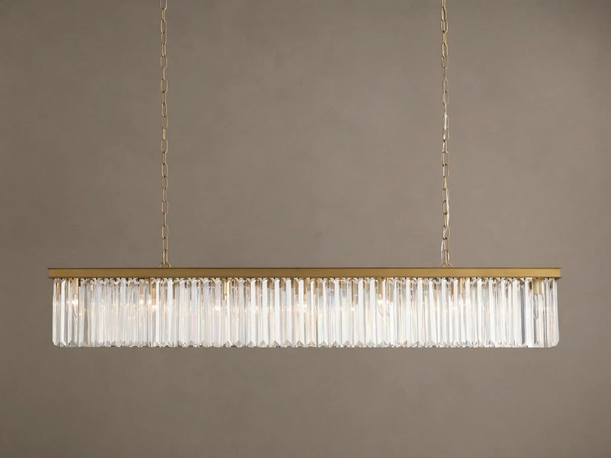 Leyland Rectangular Chandelier: Gold-toned frame with rows of clear, multifaceted K9 glass crystals, illuminated, hanging.