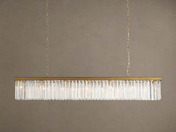 Leyland Rectangular Chandelier: Gold-toned frame with rows of clear, multifaceted K9 glass crystals, illuminated, hanging.