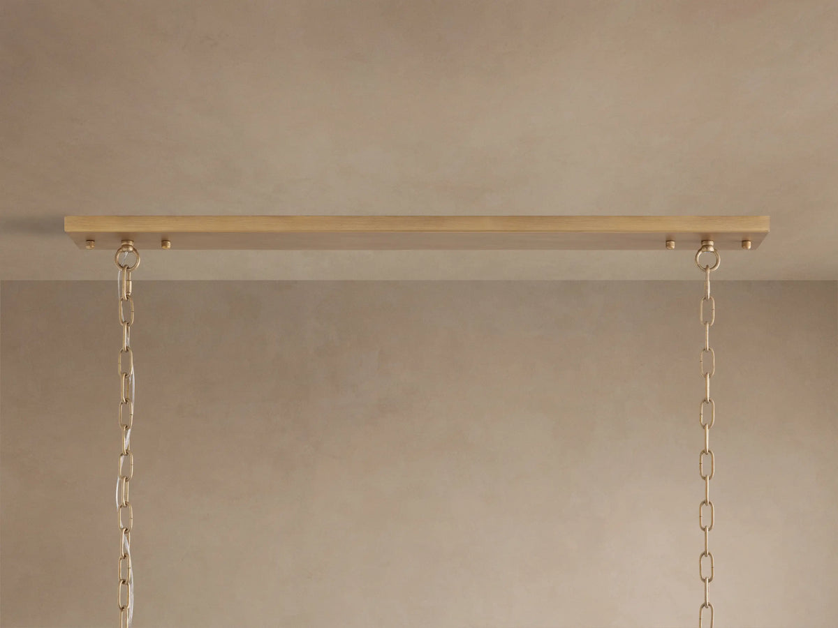 Leyland Rectangular Chandelier with oil-rubbed bronze frame and clear, faceted K9 glass crystals reflecting light.