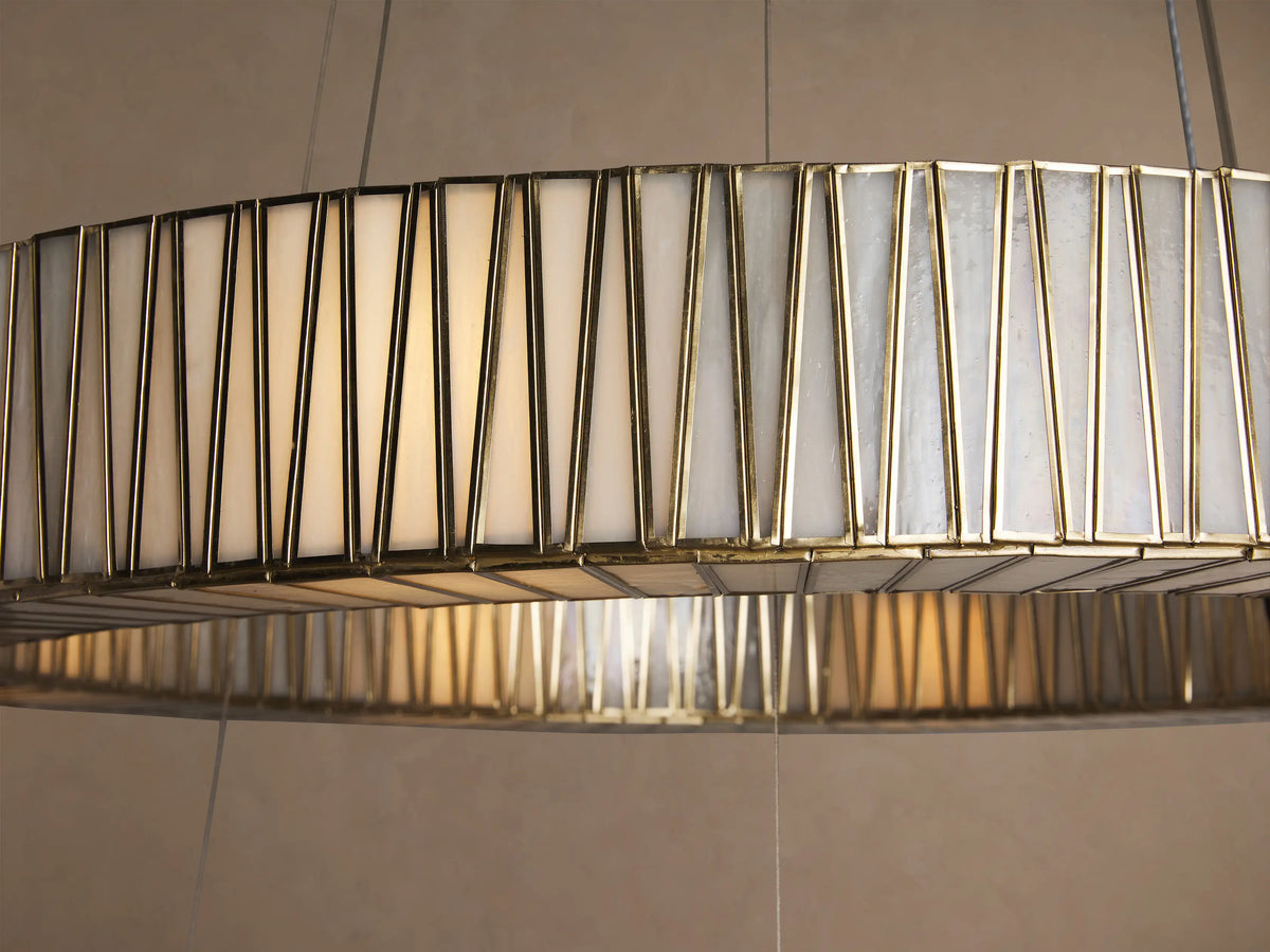 Jeunet 2-Tier Round Chandelier, two concentric grey rings with vertical textured glass segments, suspended from top against beige.