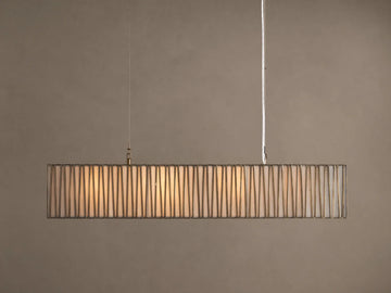 Jeunet Rectangular Chandelier with antiqued brass/nickel frame, vertical bars, and glowing white interior, hanging from ceiling.