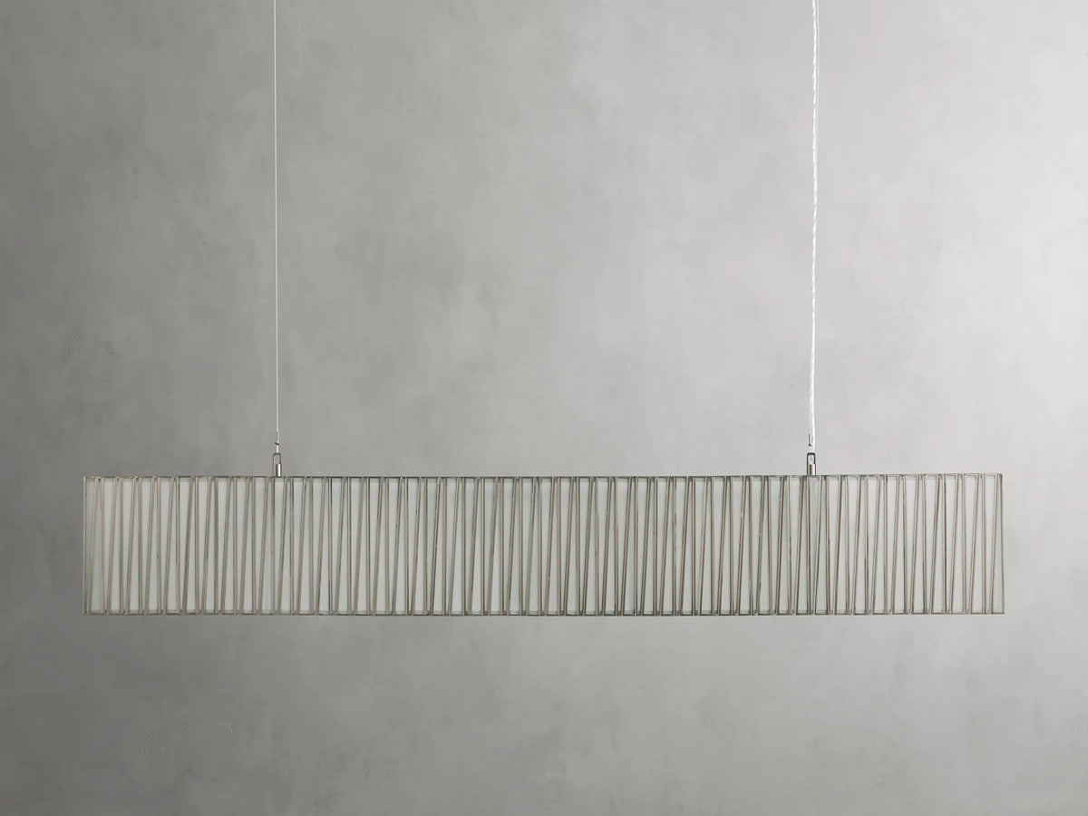 Jeunet Rectangular Chandelier in antiqued finish, featuring elongated glass and iron frame, soft warm glow, suspended by cables.