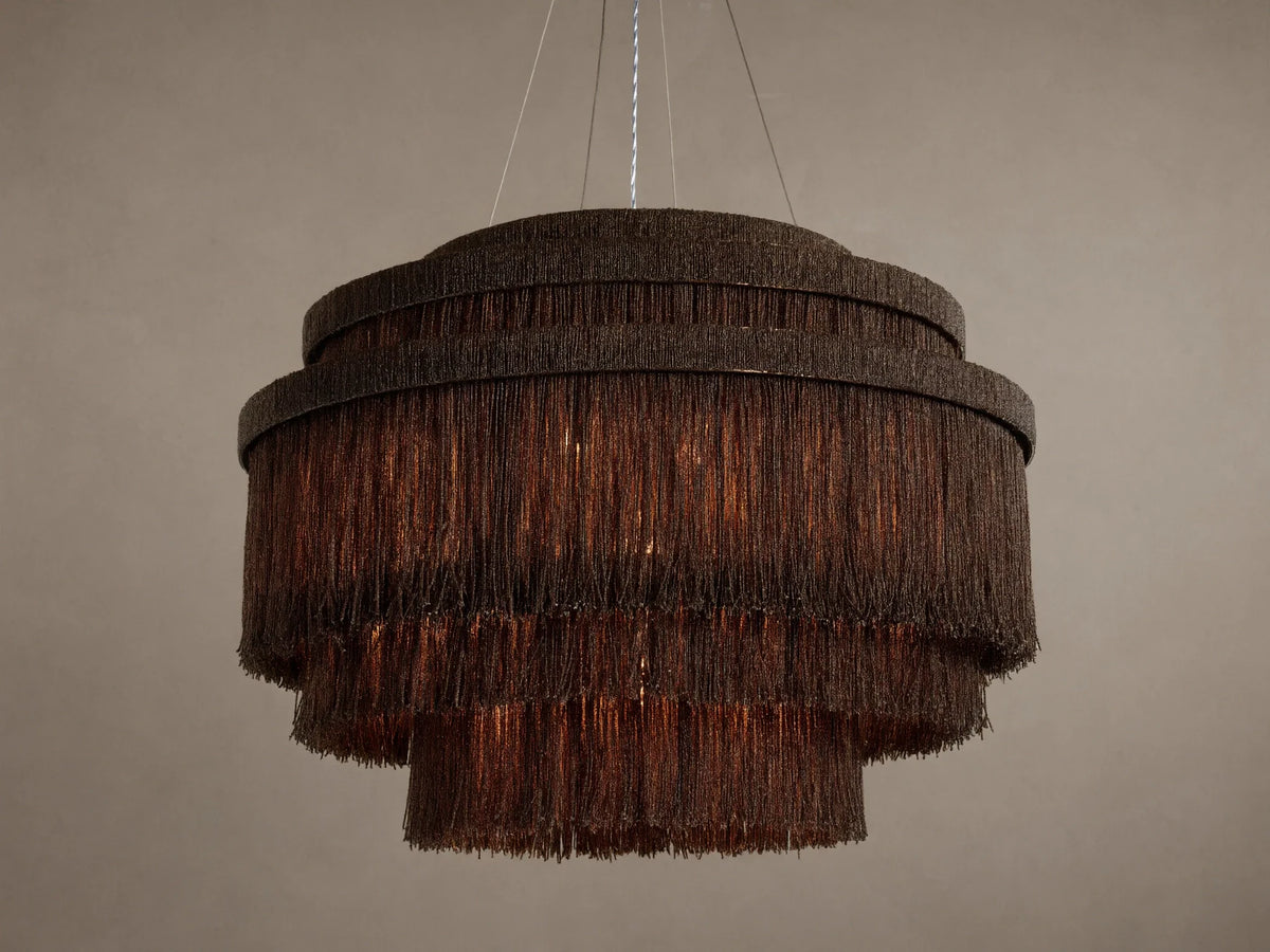 Romilly Tiered Chandelier, dark bronze iron with three tiers of hanging glass beads, warm light glowing from within.