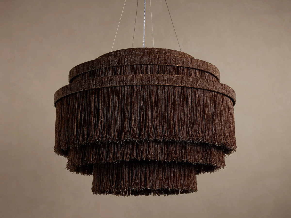 Romilly Tiered Chandelier, dark bronze iron with three tiers of hanging glass beads, warm light glowing from within.
