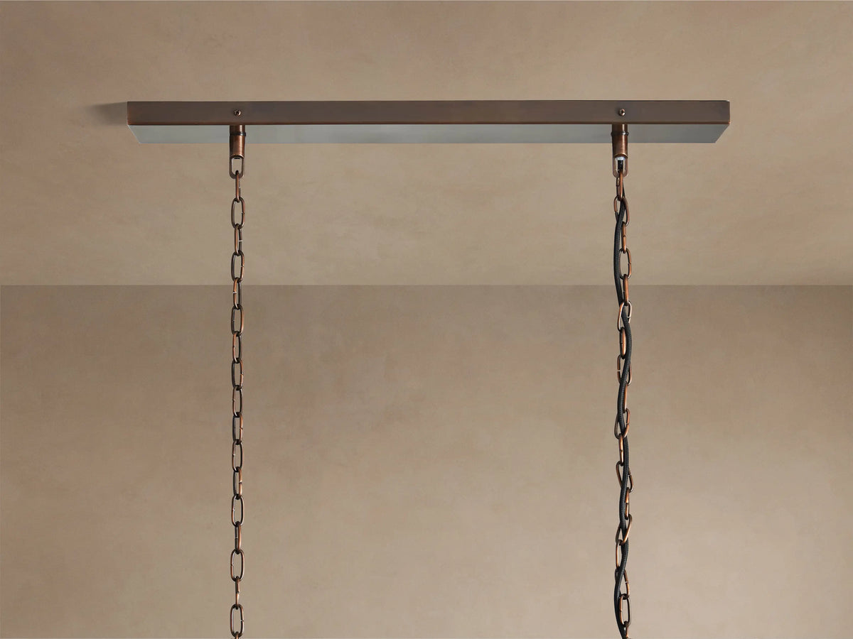 Laila Rectangular Chandelier, featuring vertical antique copper frames and antiqued mirrored-glass panes, side view.