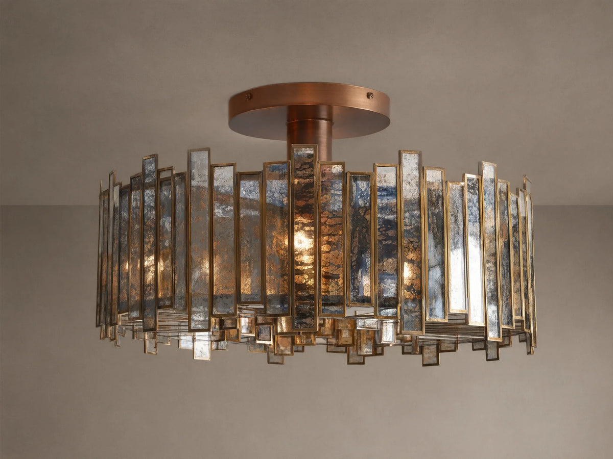 Laila Flush Mount with antique copper canopy, surrounded by rectangular antiqued mirrored-glass panes in a brass frame, lights glowing.