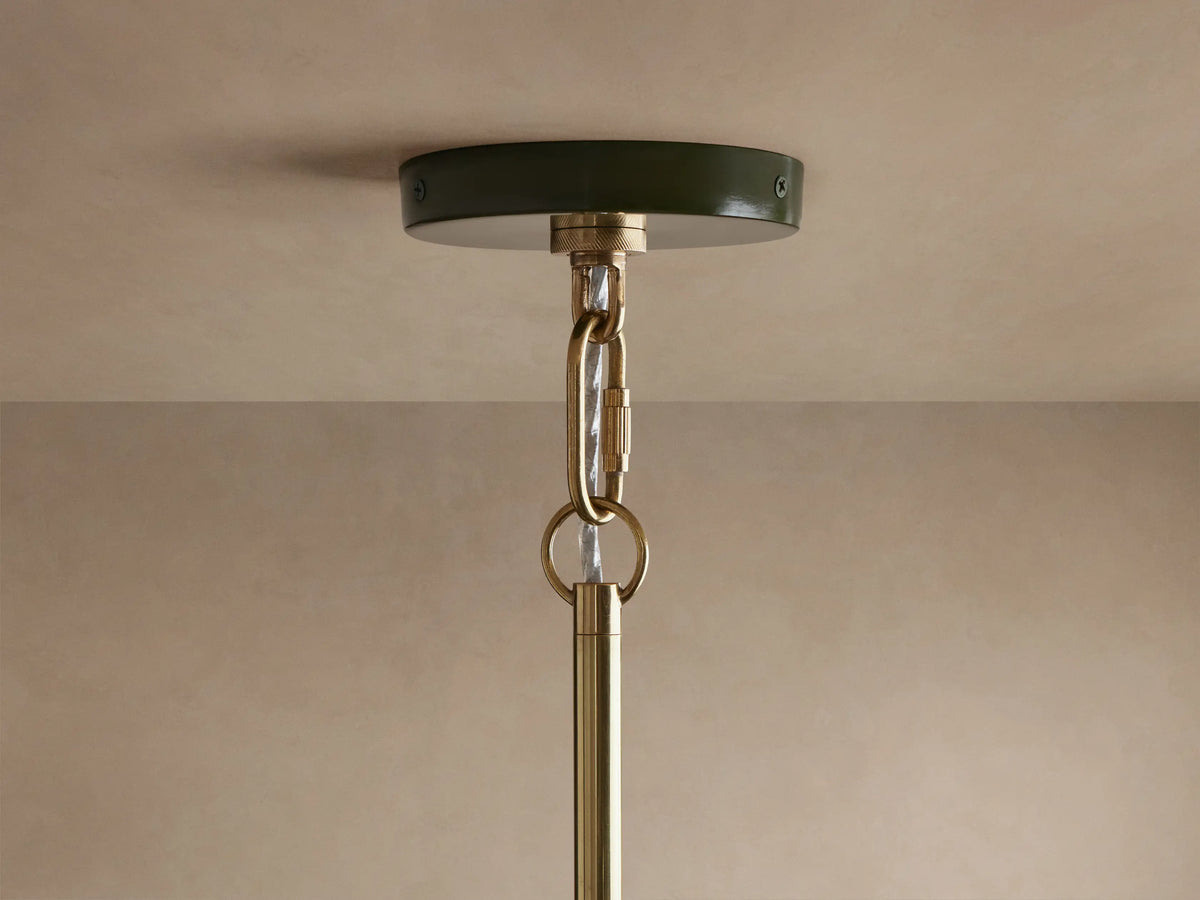 Shiny dark green Bonham Pendant light from below, showing its reflective brass interior with two warm, lit bulbs.